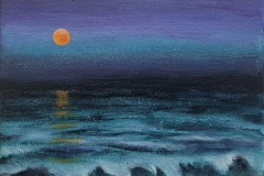 Orange moon over night waves